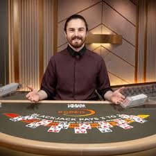 Tampilan permainan live dealer di platform raja jp88 dengan meja blackjack dan roulette